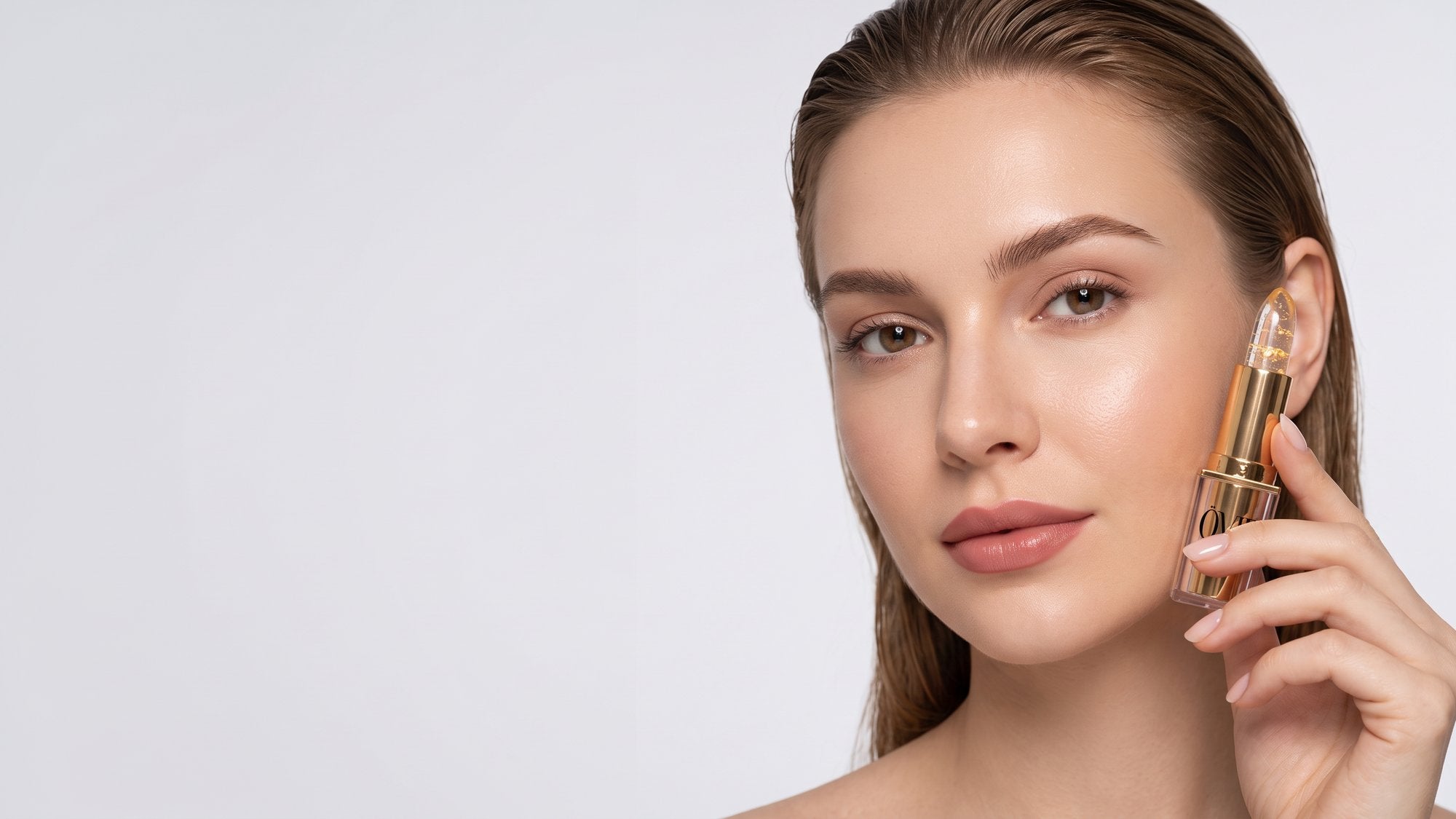 Woman wearing the ÖVIE Signature Lipstick